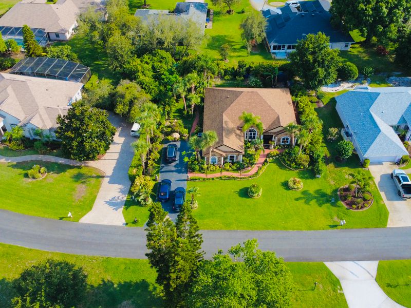 Aerial view of a single-family home on a large lot in Lehigh Acres