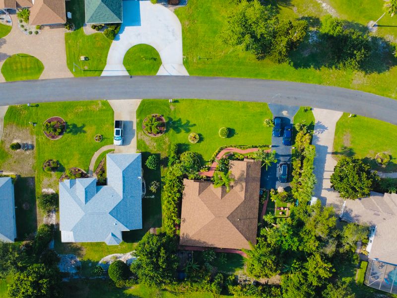 Aerial view of single-story homes on dry lots in Palm Bay